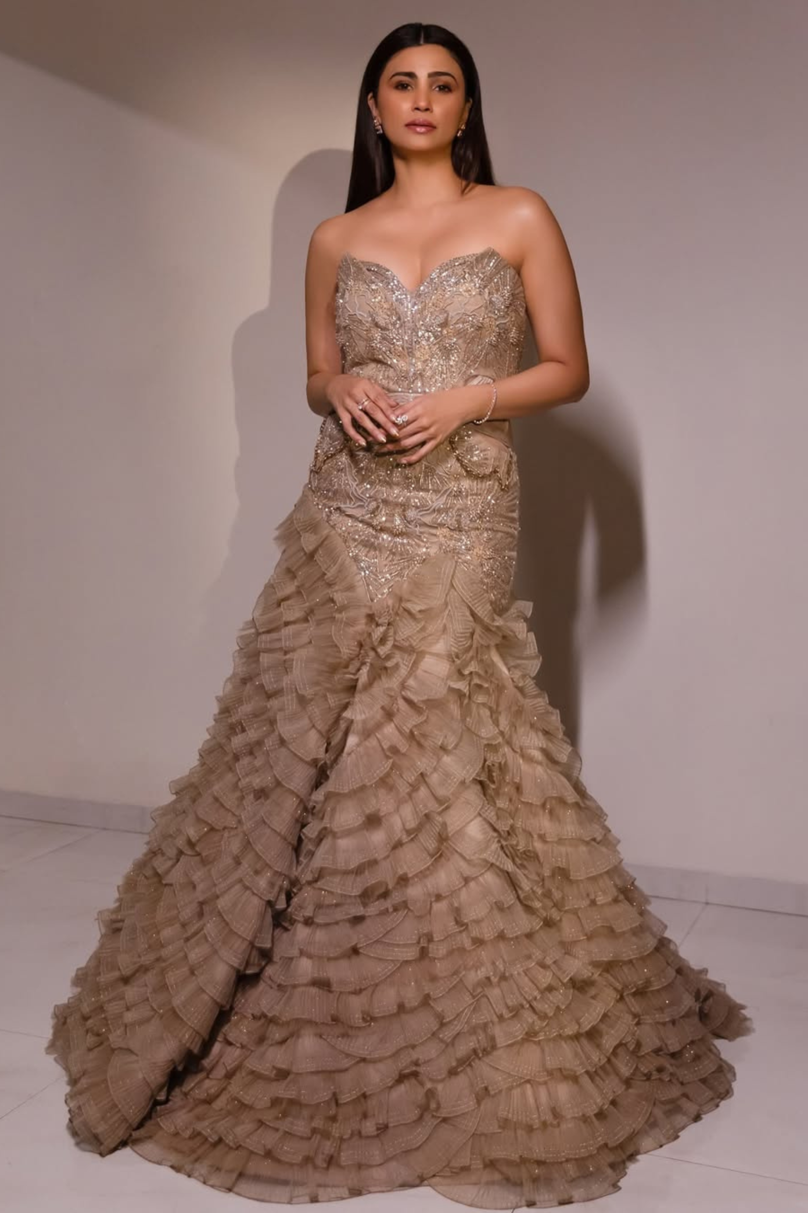 Daisy Shah in Abalone Grey and Gold Evening Gown